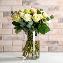 A sleek arrangement of premium white or green Ecuadorian roses accented with specialty greenery, styled in a modern, minimalist design.