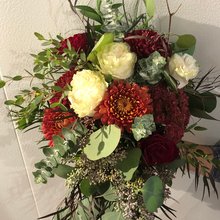 Fresh seasonal flowers in a custom hand-tied bouquet, expertly arranged and wrapped by a florist—unique for every occasion, no vase included.