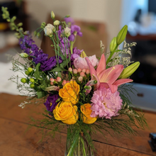 Fresh seasonal flowers in a custom hand-tied bouquet, expertly arranged and wrapped by a florist—unique for every occasion, no vase included.
